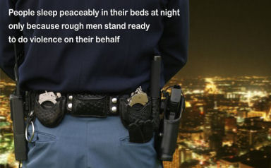 "People sleep peaceably in their beds because rough men stand ready in the night to do violence on their behalf." Image courtesy Oleg Volk, www.a-human-right.com.
